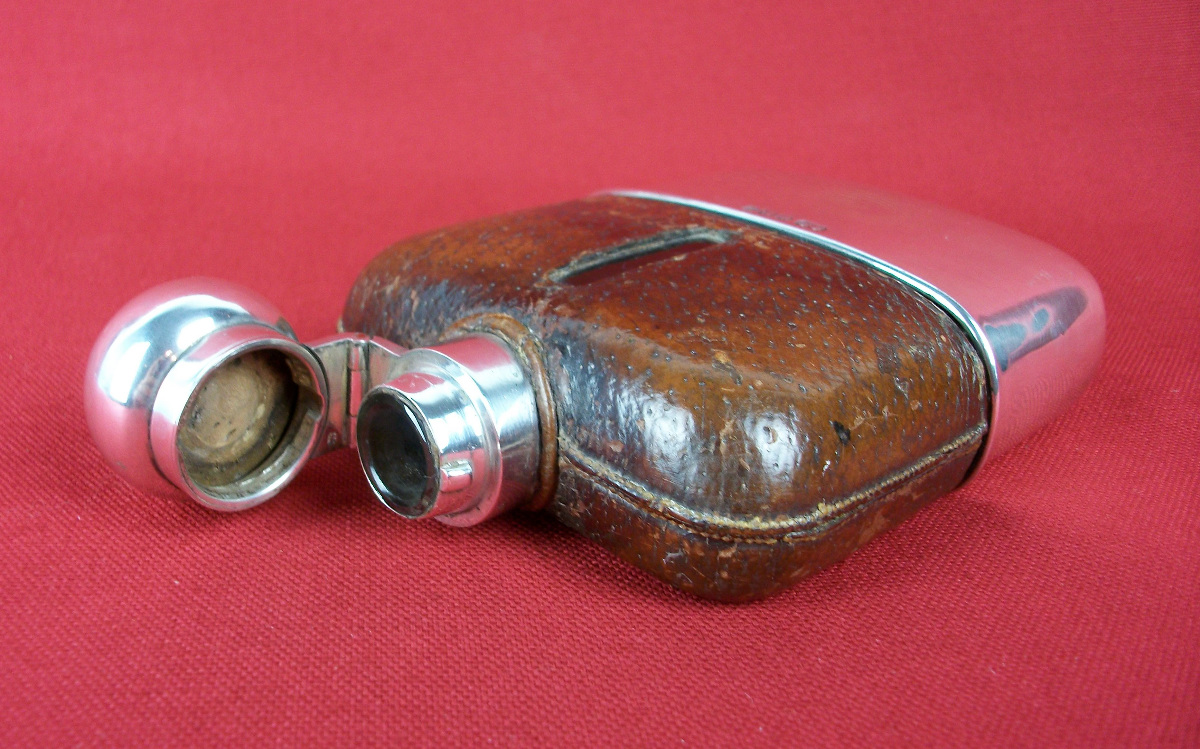 silver and leather bound hip flask